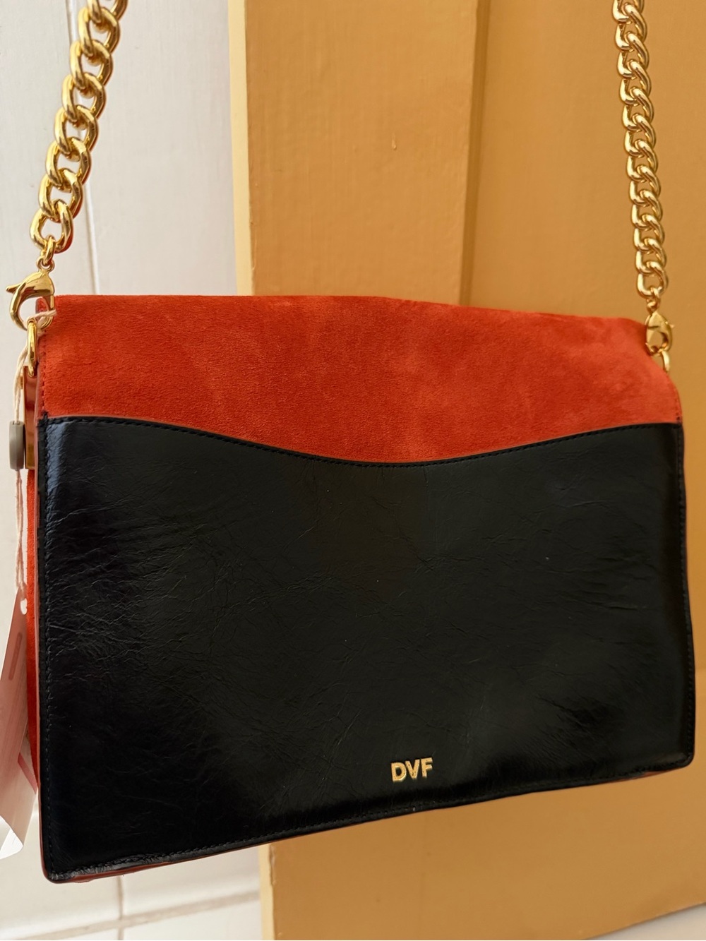 NWT Diane Von Furstenberg orange suede and black leather purse